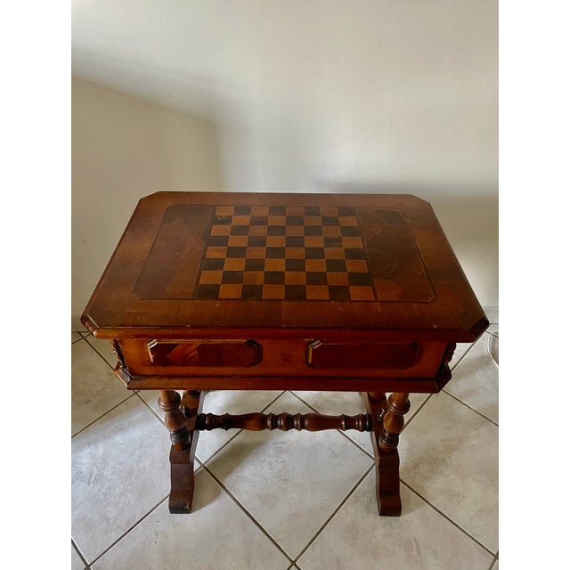 Small 1950s game table, with an inlaid chessboard top, and beneath the top, two storage drawers, two dummy drawers for...