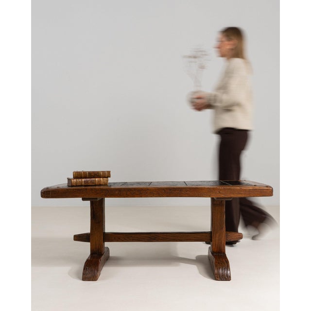 This piece presents as a piece, distinguished by dark aged oak, thick plank top. The piece dates to 1970s, sourced from...