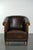This vintage and rugged sheepskin club chair features piping and has a fixed seat cushion. This beloved club chair is a...