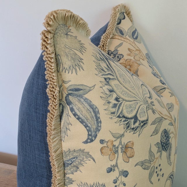 Colefax & Fowler Colmar Blue print pillow with fun loop finge trim in cream and a coordinating medium blue linen back....