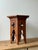 Small Arts & Crafts oak occasional table with a hexagonal top and Moorish-inspired pierced panels. A sculptural little...