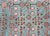 A beautiful early 20th century Central Asian Khotan with an all-over stylized pomegranate motif against a abrash indigo...