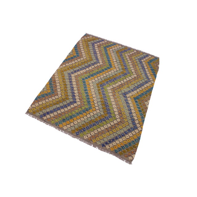 Add a touch of elegance to your home with this casual chic hand woven Tribal Kilim wool rug. Constructed on a loom by...