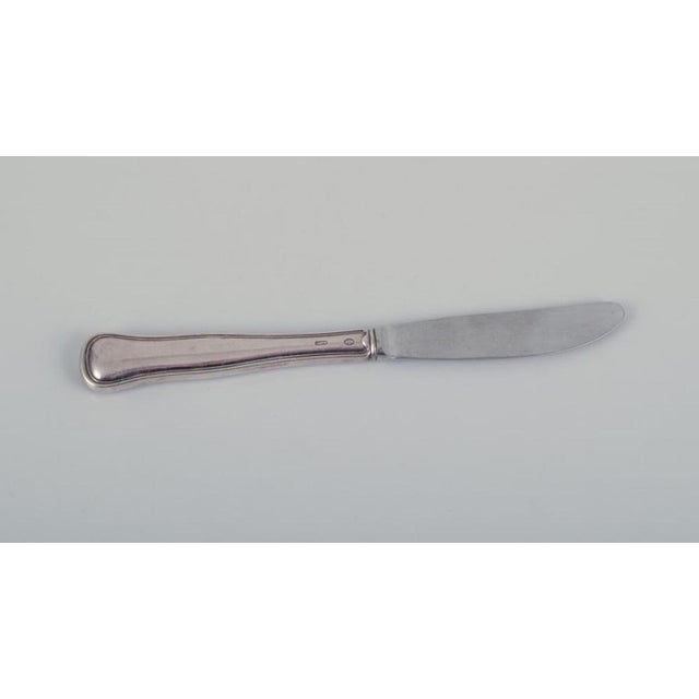 Hans Hansen, Cohr, and other Danish silversmiths. Five different knives in 830 silver and sterling silver. Classic and...