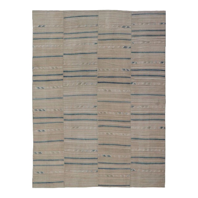 Mid 20th Century Turkish Vintage Paneled Kilim Vintage Rug in Muted Colors With Blue Highlights For Sale