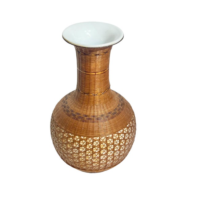 Beautiful piece of mid century art. Hand crafted white porcelain vase with a finely crafted bamboo cover. The thin strips...