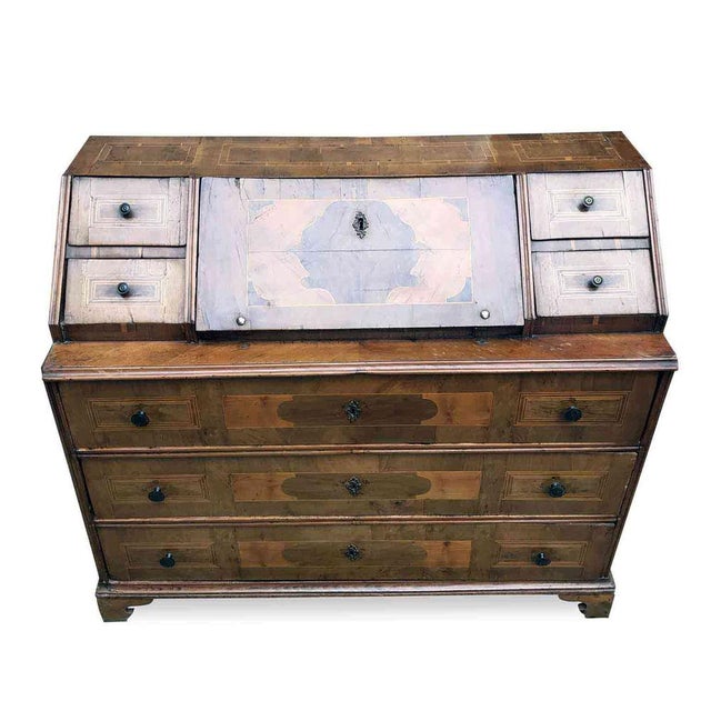 Antique Trentino Drop-Leaf Chest Veneered in walnut, decorated with geometric maple and cherry trim. The front of this...