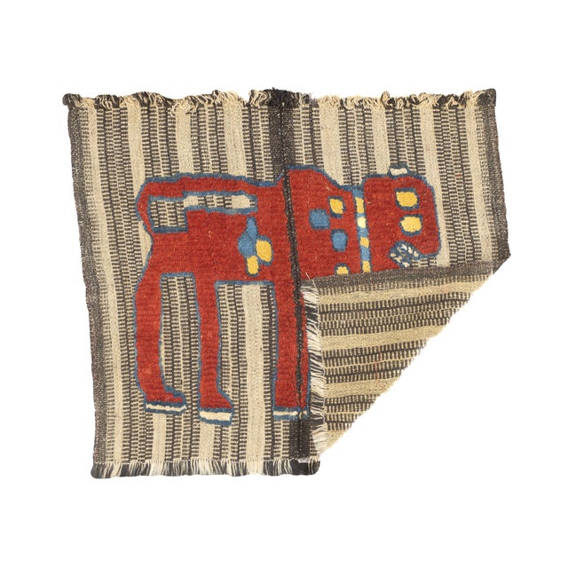 This antique Gabbeh Palas rug, woven circa 1920, is a rare piece of Persian tribal art. It features a flat-woven wool base...