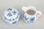 Meissen Blue Onion pattern sugar bowl and cream jug, mid-20th century. A charming set consisting of a classic lidded sugar...
