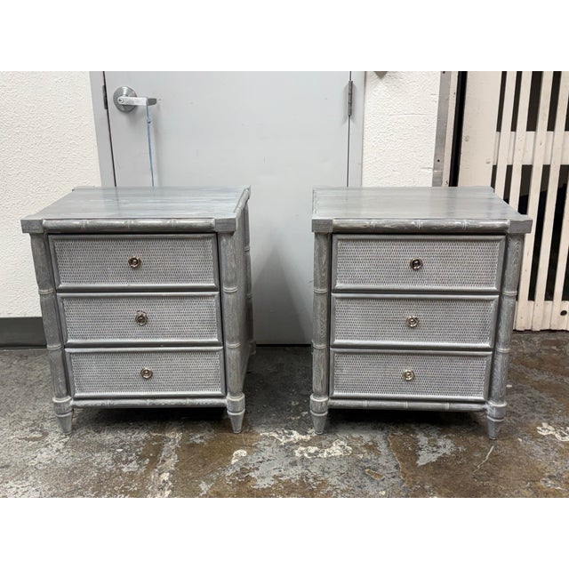 Design Plus Gallery presents a Pair of Nightstands from Dovetail Furniture. The nightstands have faux bamboo detailing...