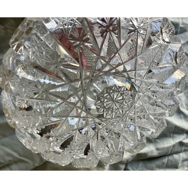 This is a lovely 6" diameter small round bowl with brilliant cut glass with deep grooves separating the lovely cut design....