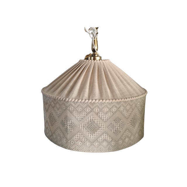 It is an extremely rare pendant lamp with a shade made from two different textile techniques – pleated linen and handmade...