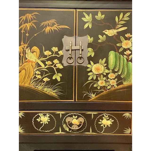 Black Lacquer Hand Painted Shanxi Buffet Table is made out of elm wood. It has 2 drawers and 4 Doors. Each compartment has...