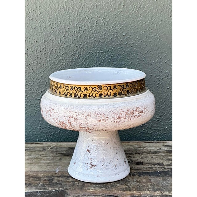This sophisticated 1960s Italian ceramic pedestal bowl, imported by the renowned Rosenthal Netter, is a striking example...