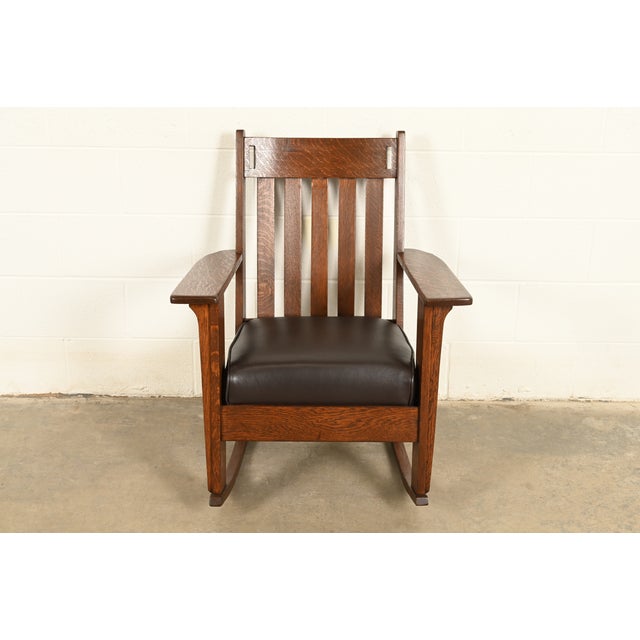 A gorgeous antique Mission or Arts & Crafts period cutout rocking chair By Charles Stickley USA, Circa 1910 Solid quarter...