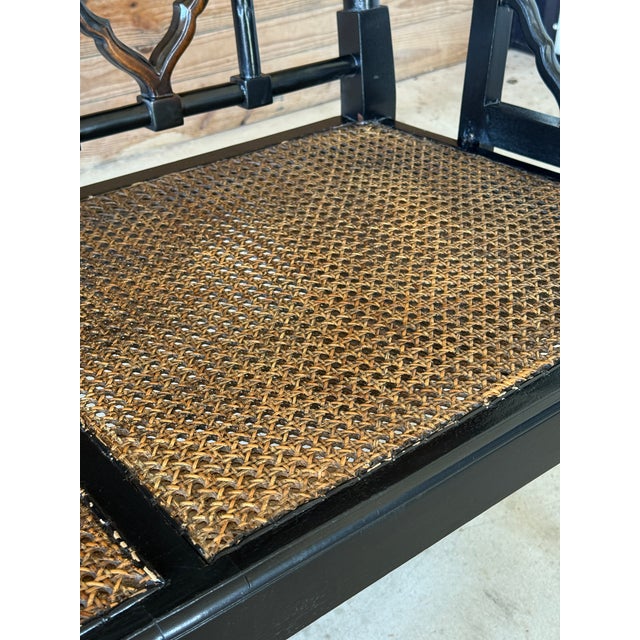 A striking early 21st century three-seat settee bench crafted in the Chippendale style. Featuring a bold black lacquered...