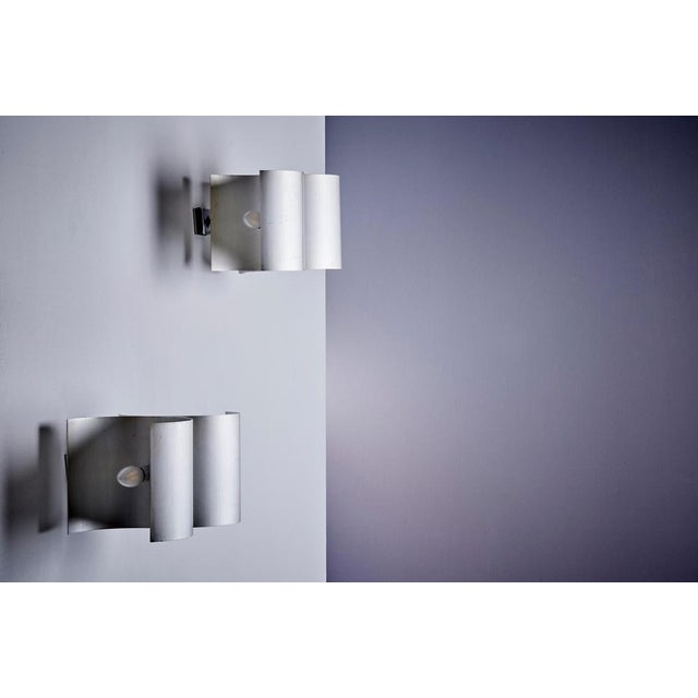 Elegant pair of wall lamps designed by Giuliano Cesari in the 1960s and produced by Nucleo Sormani in Italy. Each lamp...