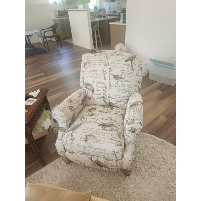 TWO transitional recliners with push through 3-way arms, exposed legs, rolled arms and welt cord trim. Color birdsong...