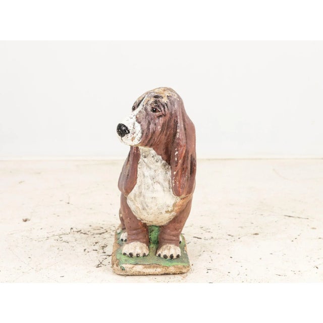 This charming hound dog garden ornament boasts a captivating patina that has gracefully aged over time retaining some...
