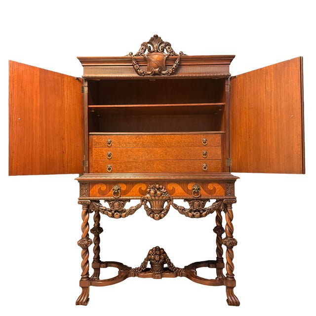 Monumental Victorian Revival style cabinet by Empire Mfg. Co. of Rockford, Illinois, featuring exceptionally detailed...