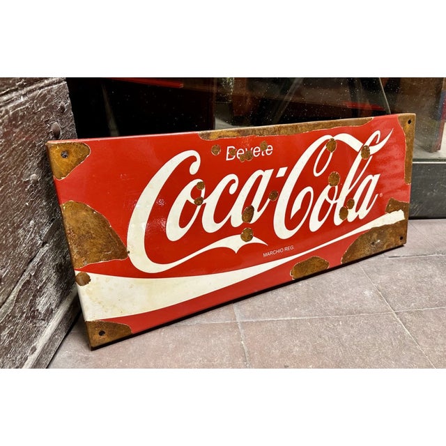 Vintage Coca Cola sign, enameled with rust spots due to time