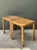 Exuding organic warmth and effortless mid-century elegance, this matched pair of vintage side tables brings a touch of...