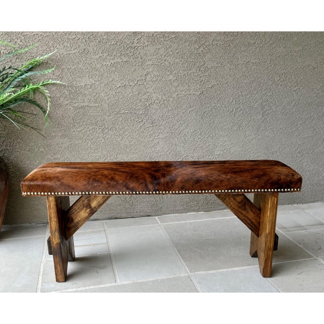 Excellent Pre-Owned Condition. Fabulous Western chic hair-on-hide ranch-style accent bench with decorative all-around...