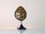 This table lamp reflects the French decorative aesthetic popularized by Maison Jansen in the 1970s. The piece features an...