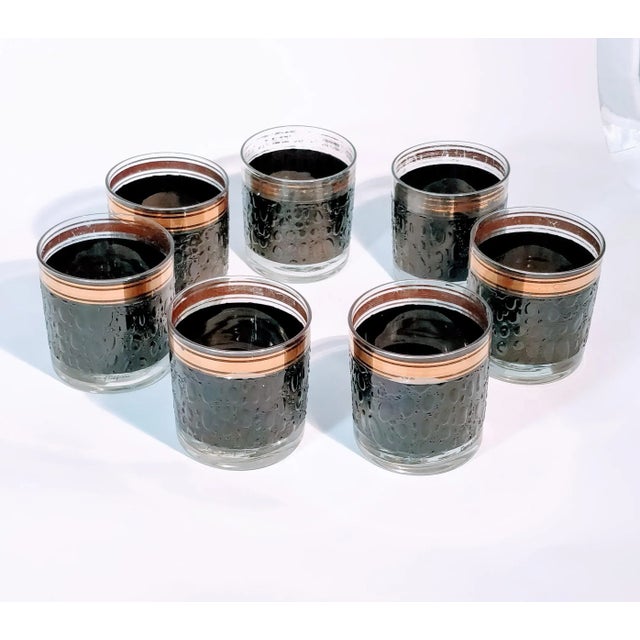 These stunning vintage barware glasses are truly eye-catching. Each glass features a beautiful shiny black embossed raised...