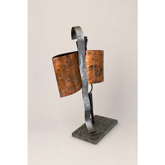 Striking postmodern abstract sculpture in the American Brutalist tradition. Two sweeping panels of flame-patinated copper...