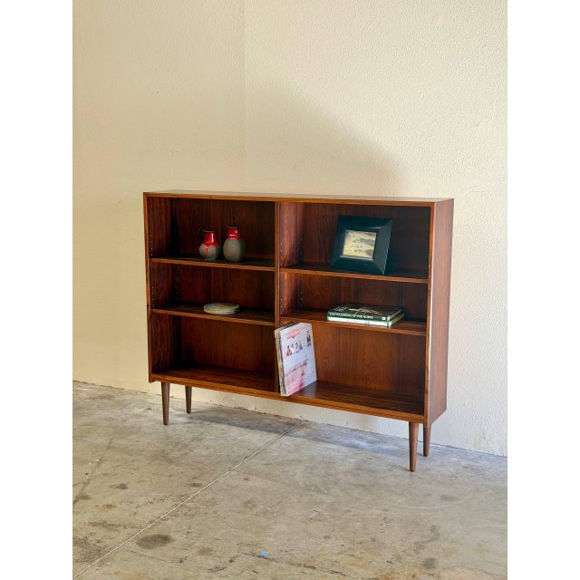 Beautiful vintage Danish Mid-Century Modern bookcase crafted in richly grained rosewood, dating to the 1960s. This piece...