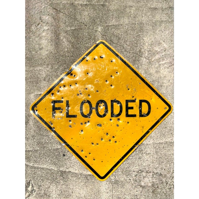 This authentic vintage "Flooded" road sign is a striking example of industrial Americana and found-object art. Featuring a...