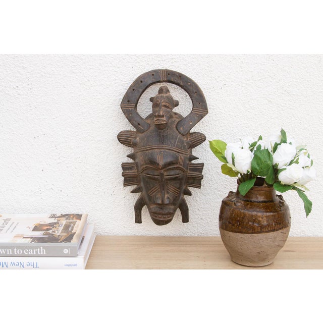 This charming Kwele mask from Gabon or the Republic of Congo is a delightful example of African tribal art. The surface is...