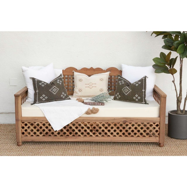 An exotic Moroccan-inspired daybed with a Mousharabi lattice design. Mousharabi, is a traditional architectural element...