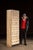 Tall, narrow ledger cabinet constructed in painted hardwood with a bank of twenty-eight small drawers arranged in a tight...