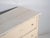 Antique painted pine chest of drawers from Central Europe, dating to around 1900, featuring a distressed rustic finish and...