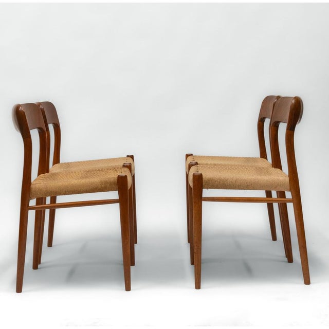 Set of four teak dining chairs with cord seating designed by Niels Otto Moller for JL Mollers. Model 75. Maker's stamps to...
