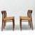 Set of four teak dining chairs with cord seating designed by Niels Otto Moller for JL Mollers. Model 75. Maker's stamps to...