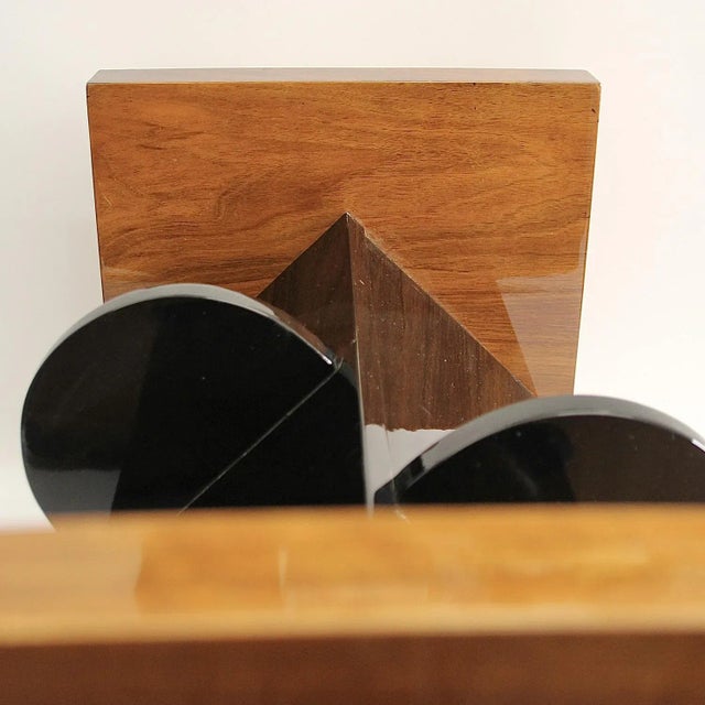 This rectangular side table with a curved table top on two sides in a classic Art Deco shape dates from the 1930s and is...