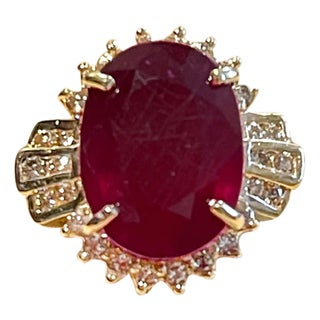 Oval 12 Carat Treated Ruby and 1 Carat Diamond 14 Karat Yellow Gold Ring For Sale