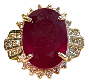 Oval 12 Carat Treated Ruby and 1 Carat Diamond 14 Karat Yellow Gold Ring