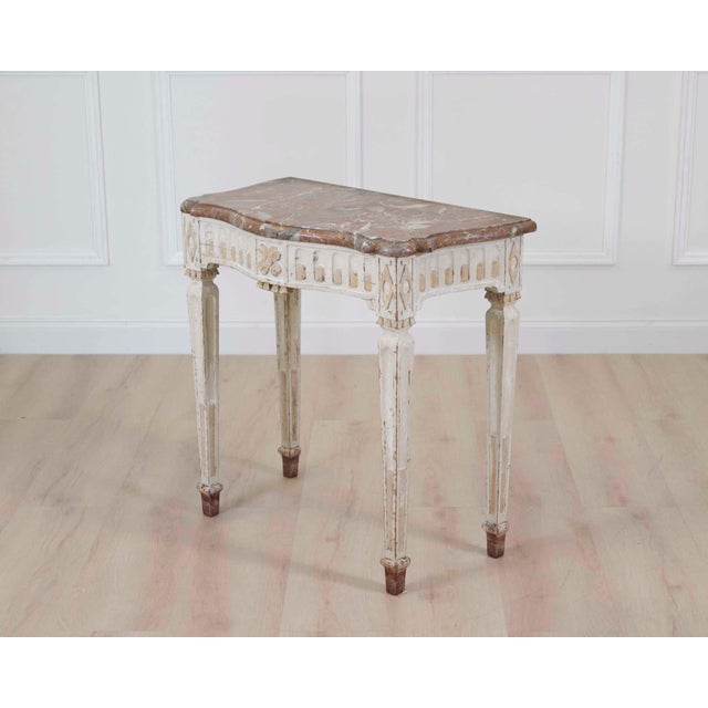 Elegant Louis XVI period console table dating from the late 18th century. This refined French piece displays the...