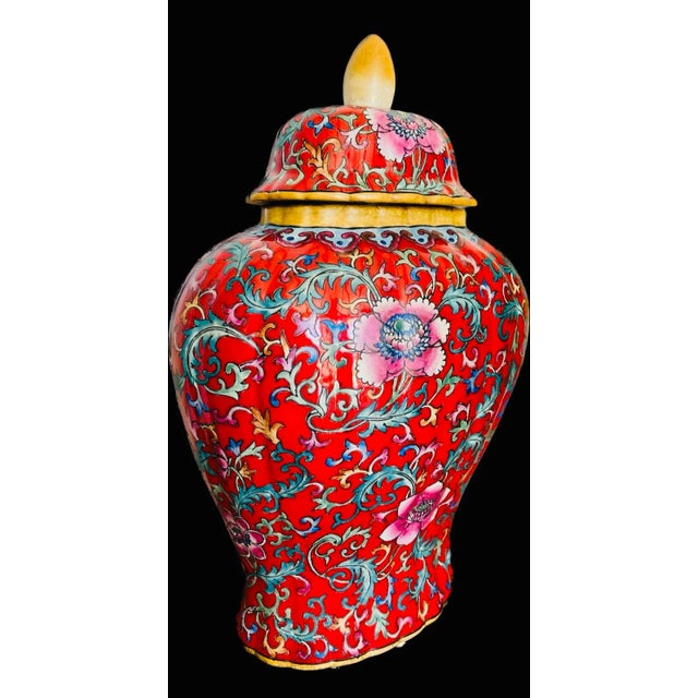 This jar,featuring famille-rose lotus flowers blossoming under the morning sun,is one of many innovative ceramic...