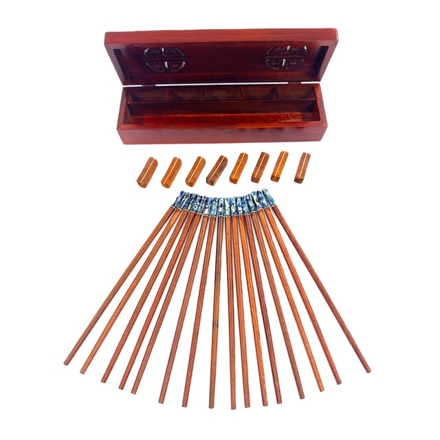 A beautiful handmade set of chopsticks finished in a warm, natural wood grain complemented by striking blue and ivory...