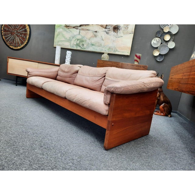 High-quality three-seater sofa by A. Mikael Laursen. Solid teak frame with original leather cushions. The sofa was...