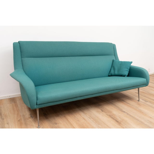 Sofa by Bengt Ruda for Artifort. The sofa is upholstered with green fabric on a metal frame. I have official proof of...