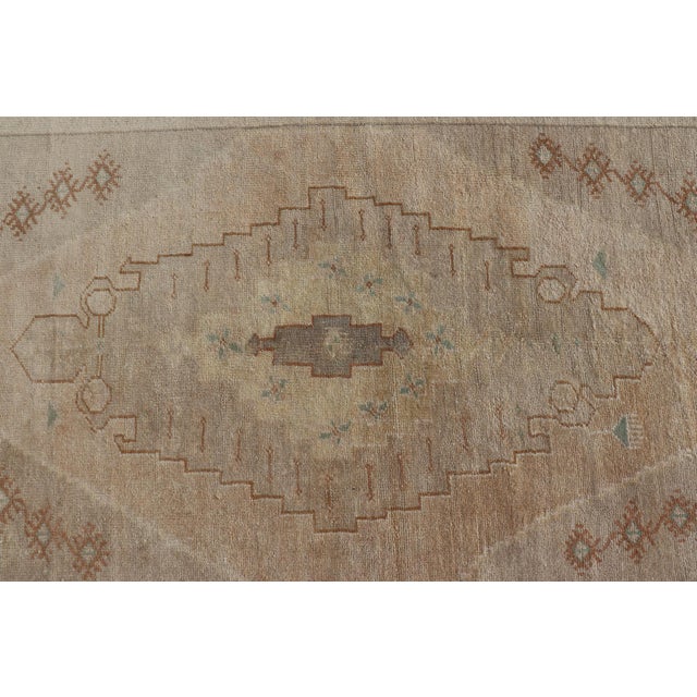 Textile Vintage Oushak Rug From Turkey With Muted Colors and Tribal Medallion For Sale - Image 7 of 11