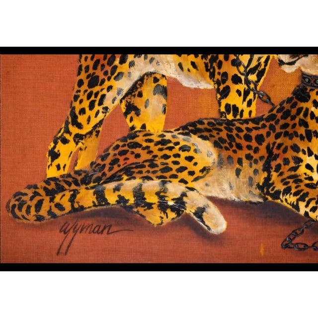 Large hand-painted decorator painting from around 1970, signed Wyman at lower left. Two chained cheetahs in studded...