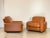 Pair of Piumotto leather armchairs by Arrigo Arrigoni for Busnelli, 1970s, cognac-colored leather, black plastic shell...