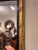 The is a 19th century gold and ebony restoration mirror with amazing neoclassical scroll work on the frame. It shows...